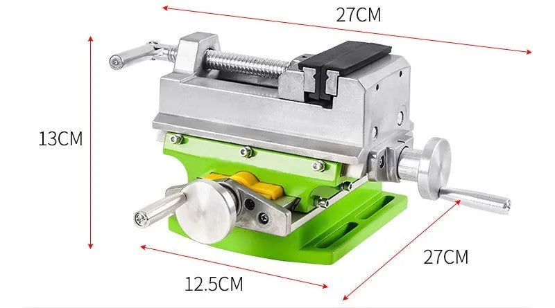 Bench drill milling machine on a workbench with cross bench pliers.