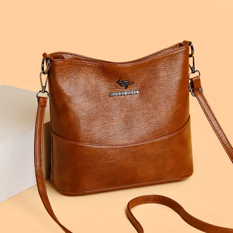 Women's soft leather large capacity shoulder bag in bucket shape with minimalist luxury styling