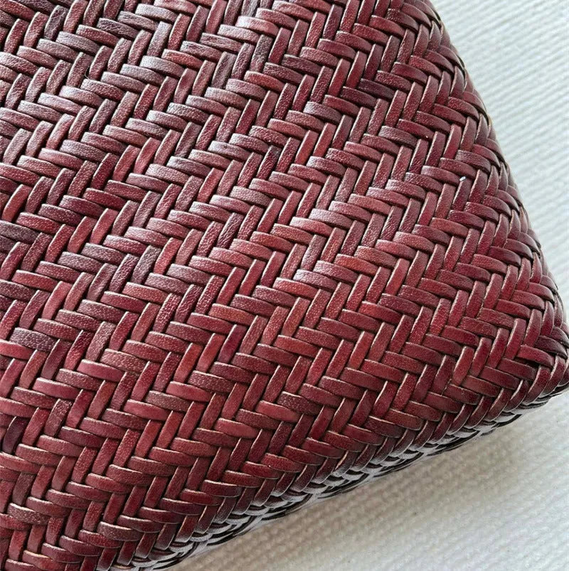 Handmade brown woven leather tote bag with three-dimensional pocket and shoulder strap