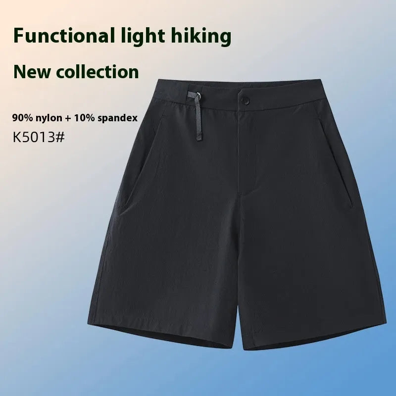Men's solid colour quick-drying sports shorts with elastic waist on a neutral background.