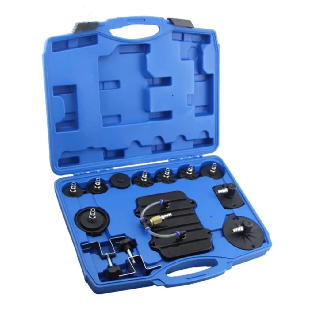 Pneumatic brake fluid replacement tool with 5L tank, pressure gauge, adapter kit, collection bottle, and fluid hose on a workbench