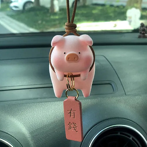 Cartoon pig character resin car ornament for dashboard or windscreen decoration.