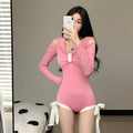 Women's long sleeve one-piece swimsuit in pink or black colours