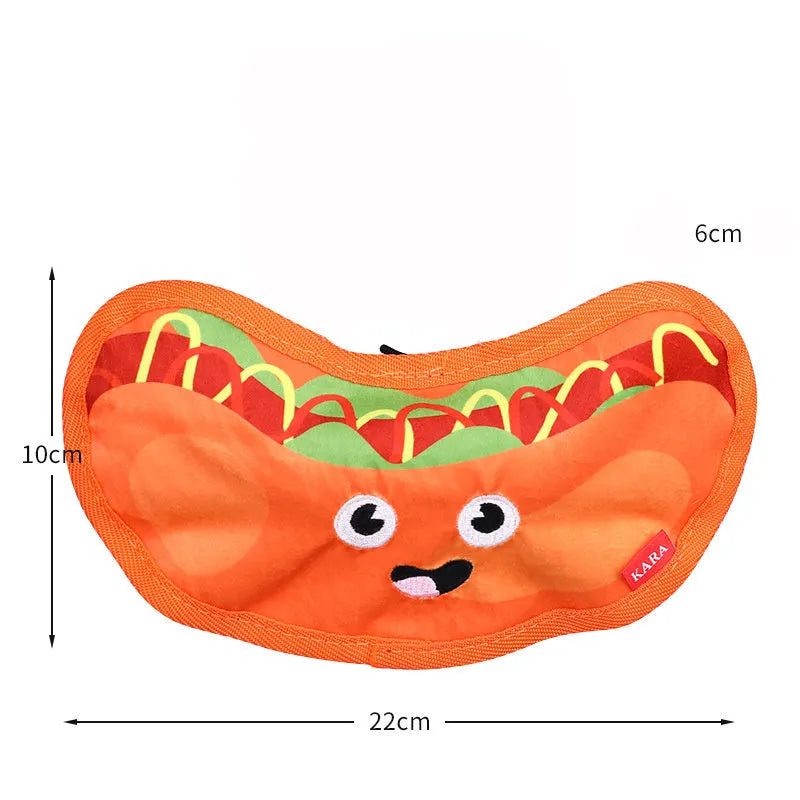 Food-themed dog chew toy in a hamburger design with red, yellow, and green colours, showcasing its no-stuffing construction.