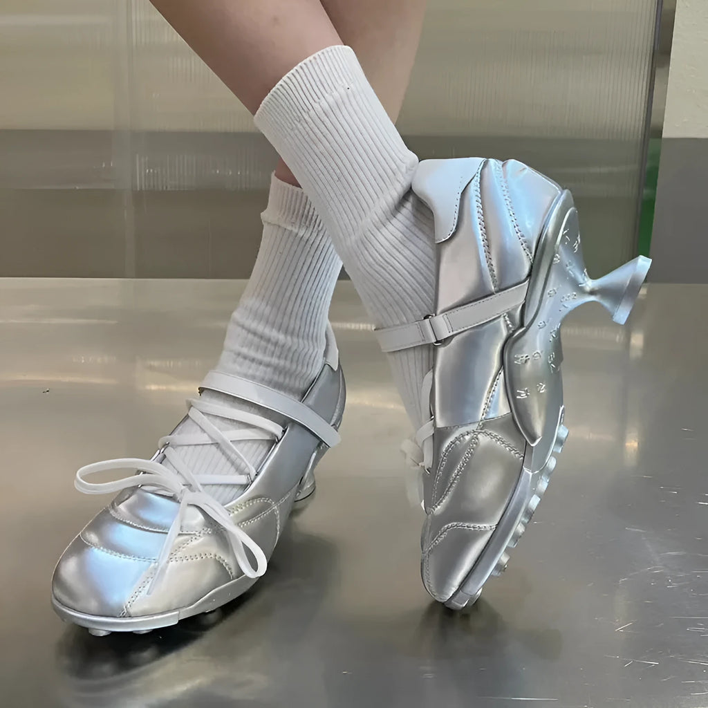 Women's silver lace-up sports-style heeled shoe with a bow detail and round toe.