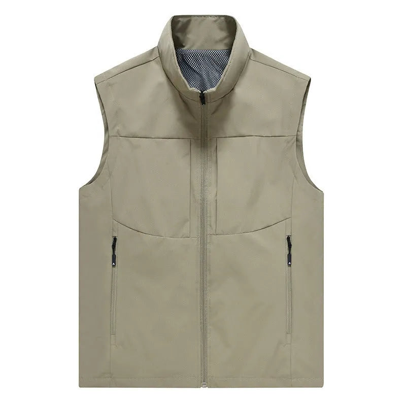 Man wearing a khaki stand collar cardigan vest with zipper pockets.