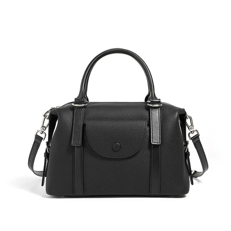 Genuine leather ladies handbag with lock detail in black, brown, or elephant grey.