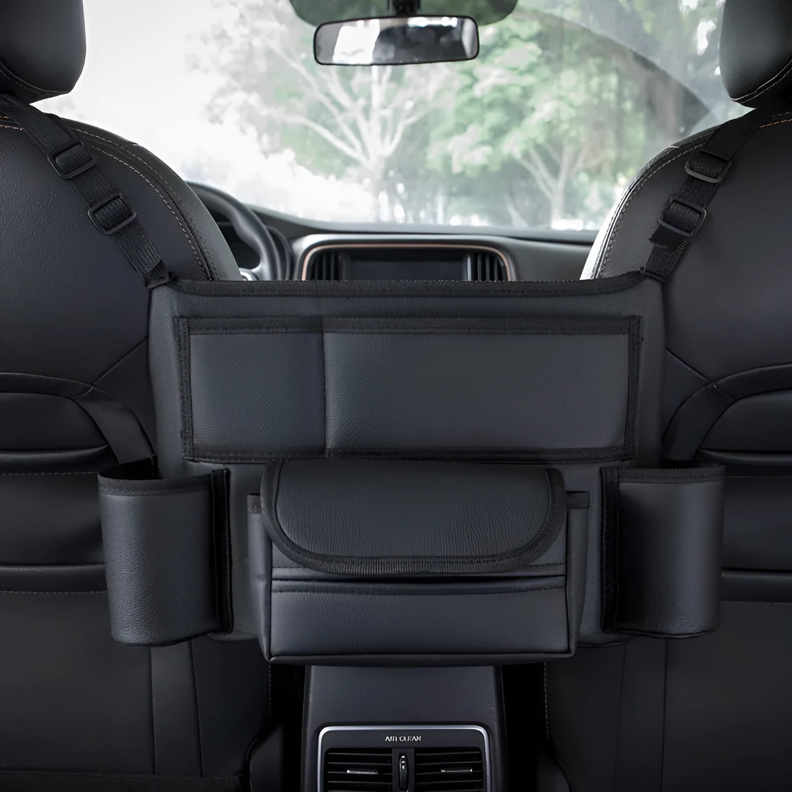 Black leather car seat hanging storage bag with tissue box between car armrests
