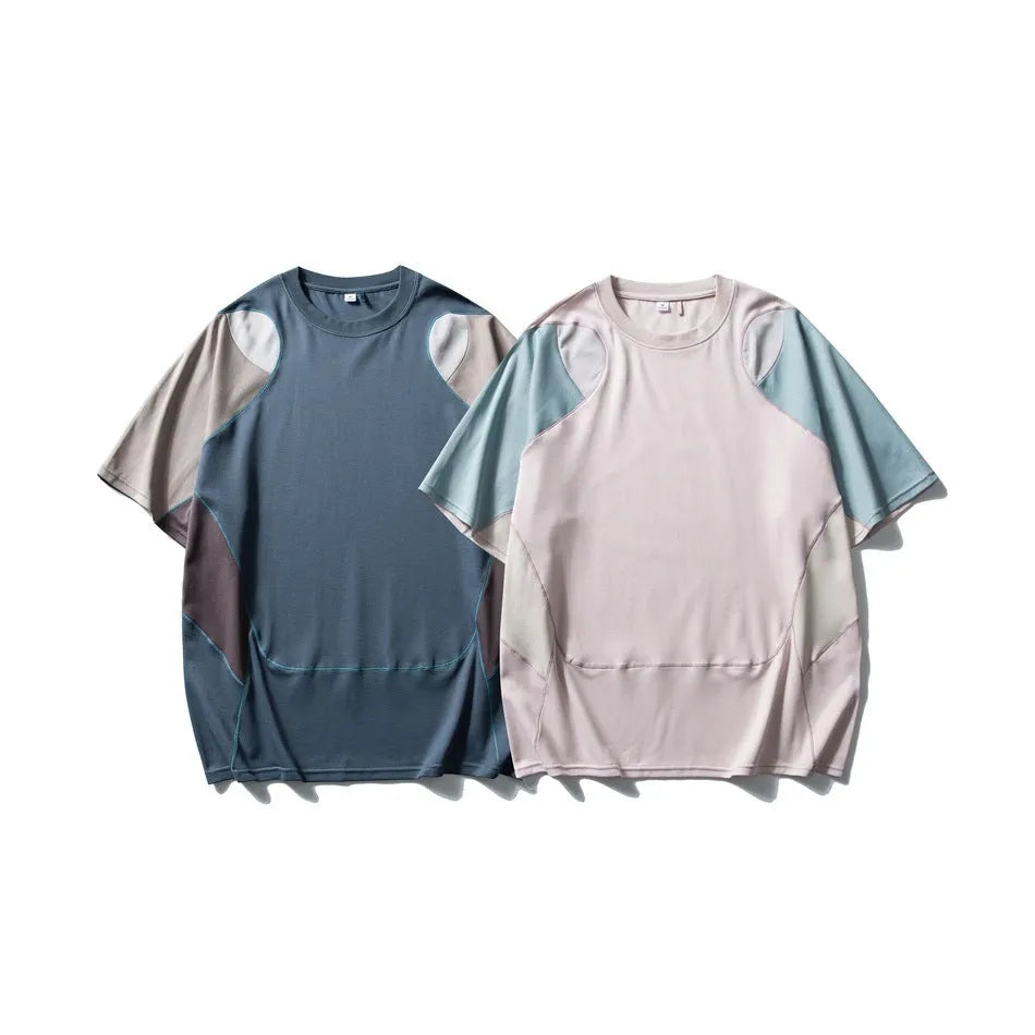 Men's loose blue patchwork t-shirt with raglan short sleeves on a mannequin.