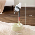 Green adjustable pet water dispenser with detachable pole and bowl on a table.