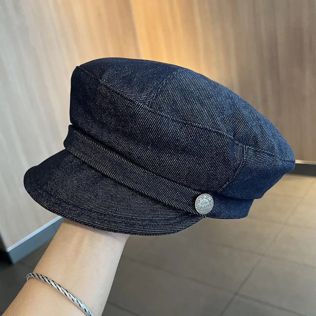 Dark blue denim octagonal newsboy hat with adjustable band and colour trim brim options