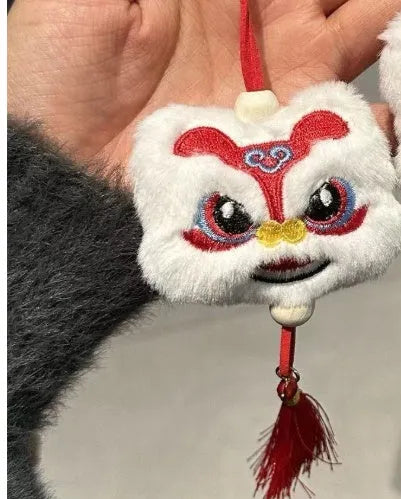 Chinese style blue and yellow plush lion keychain ornament with star stone detail and tassel