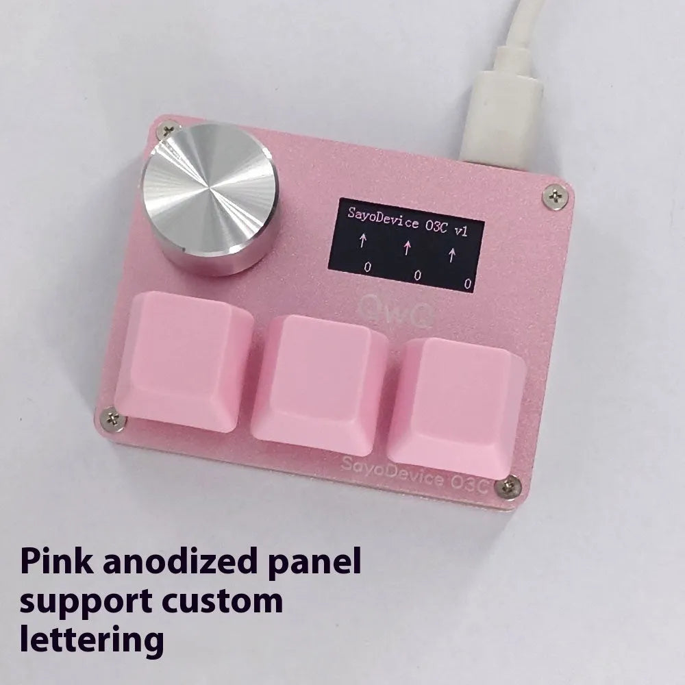 Customisable magnetic axis gaming keypad with programmable knob and colour IPS screen on desk.
