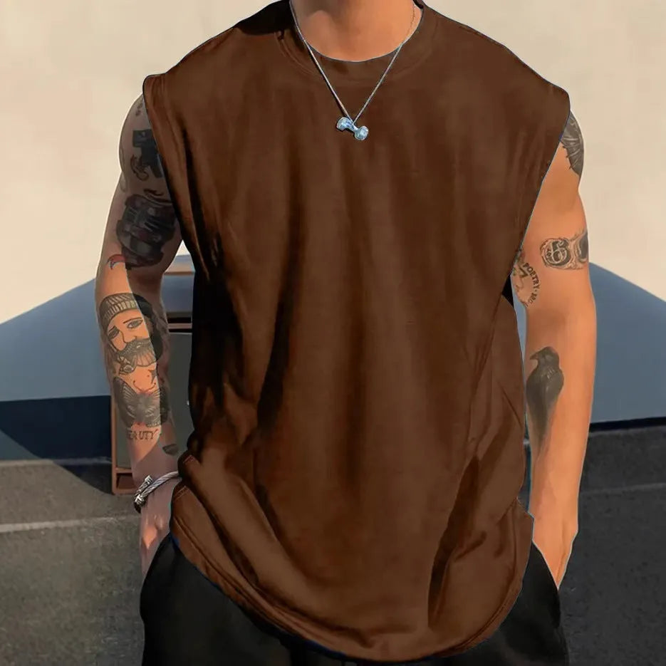 Man wearing a loose solid-colour cotton sleeveless pullover tank top.