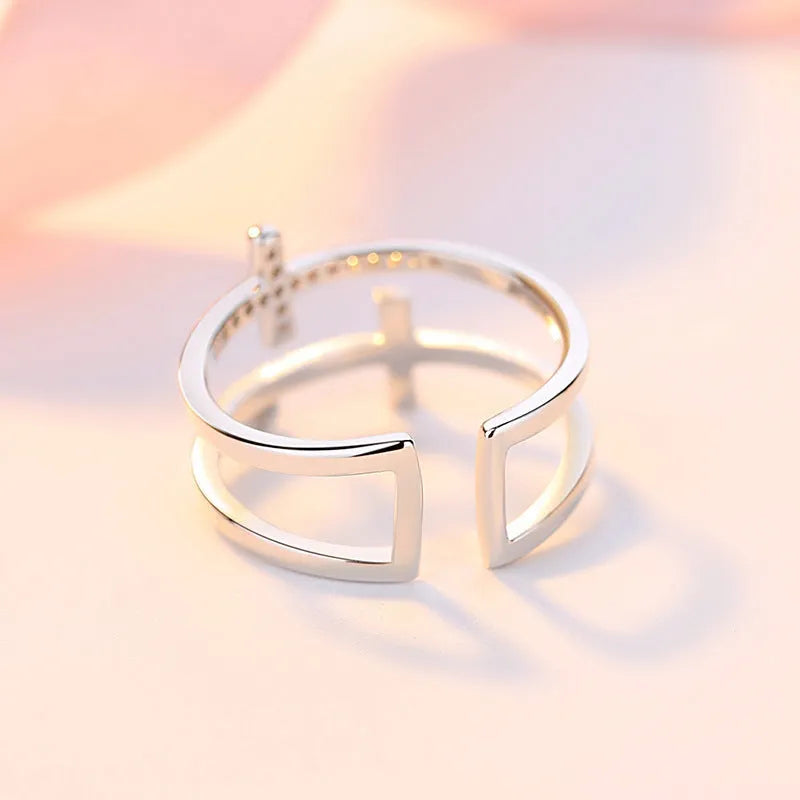 Women's adjustable copper ring with double cross design and zircon stones in white gold finish