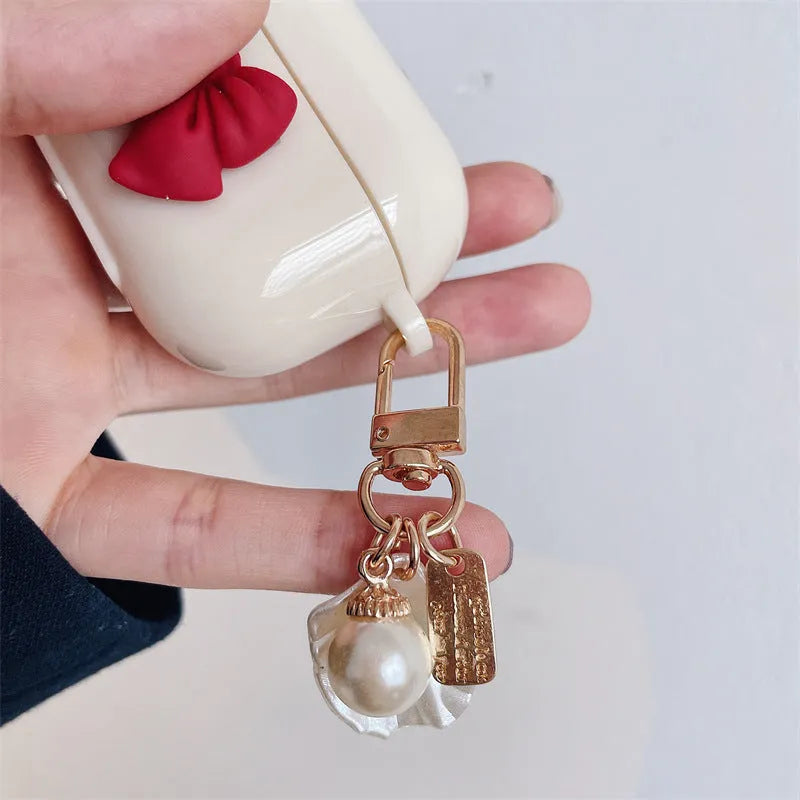 Beige red bow shell TPU case for AirPods wireless earbuds with clamshell design