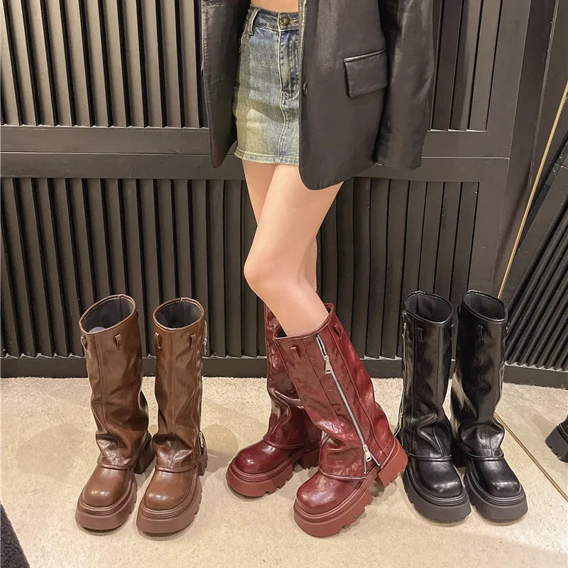 Women's black platform Martin boots with a square heel and high ankle cuff.