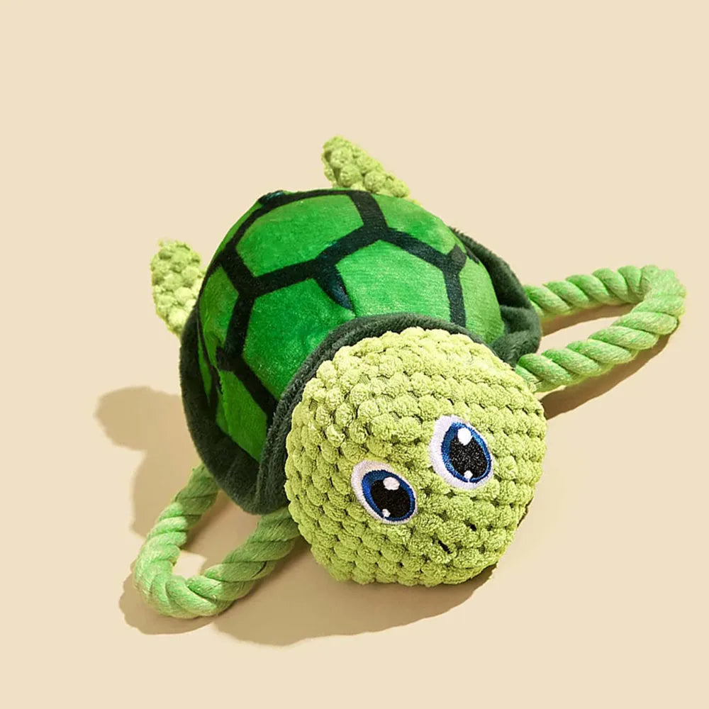 Turtle-shaped plush dog chew toy with rope core in grey, green and orange colour options