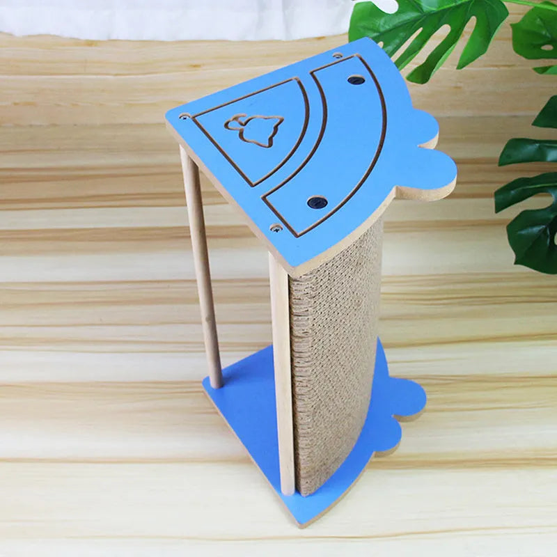 Triangular corner cat scratching pad with hanging ball toy against wall