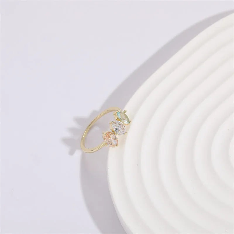 Geometric triangle ring with horse eye tricolor zircon in electroplated 14k gold colour on copper