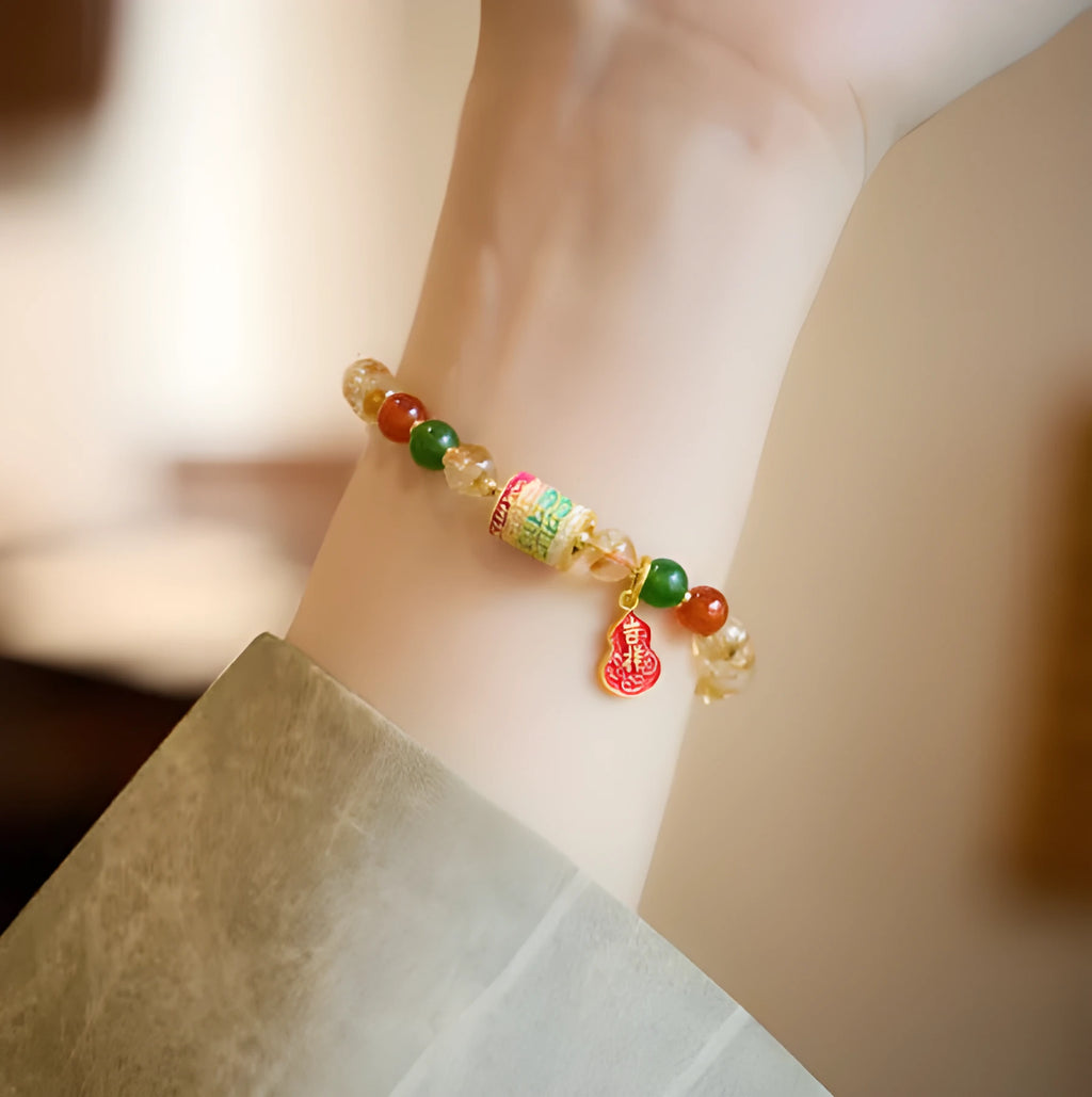 Hand-woven citrine five sutra bracelet with 6mm crystal beads showing geometric patterns
