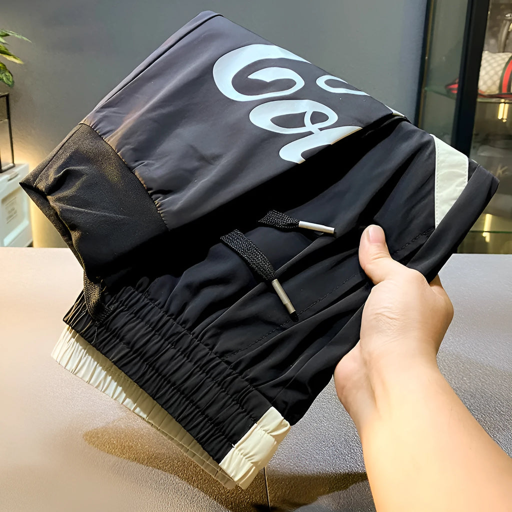 Black men's casual cropped trousers with banded ankle, made from ultra-thin ice silk cotton fabric.