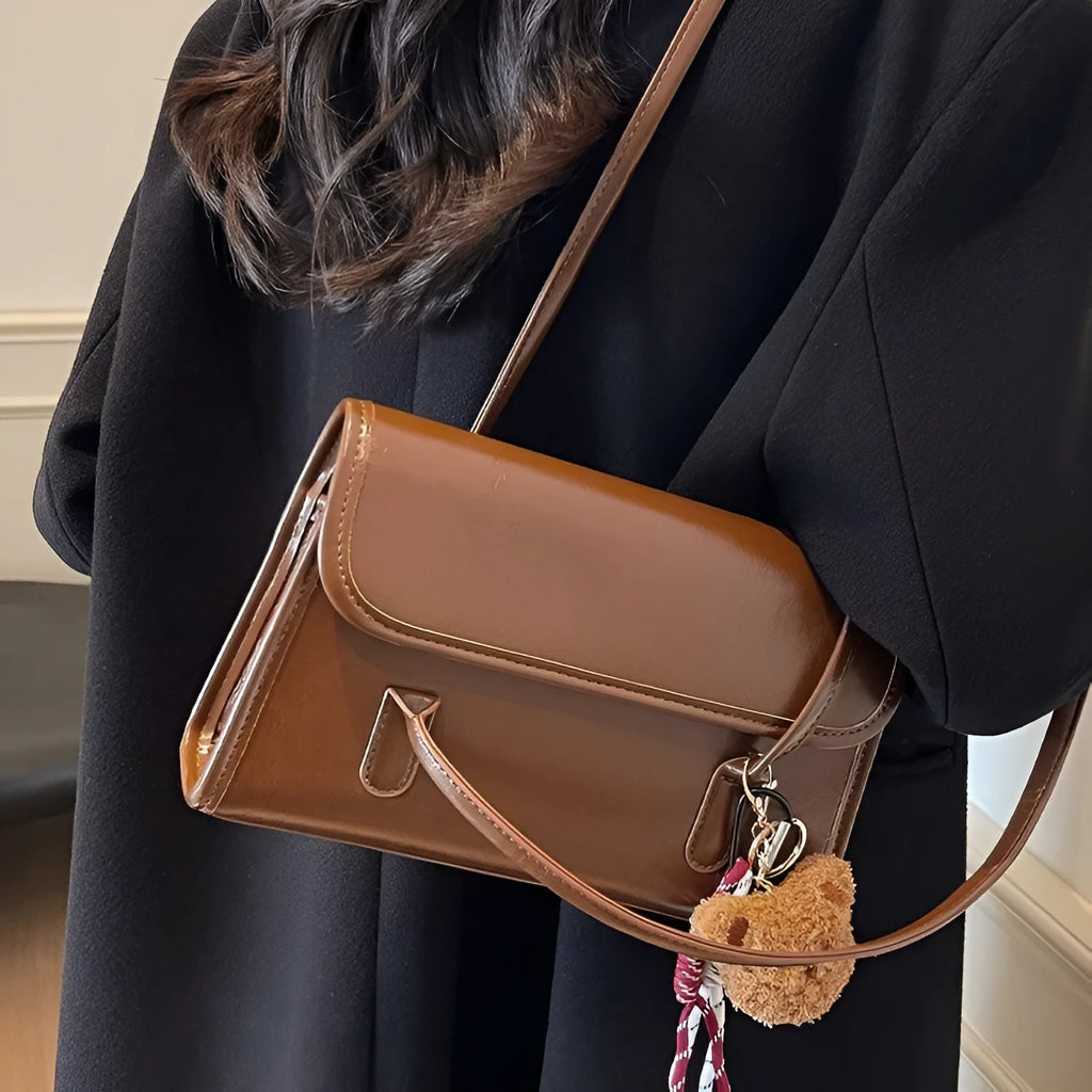 Women's brown PU leather shoulder bag with horizontal square shape and decorative pendant