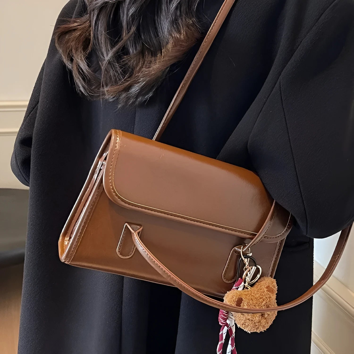 Women's brown PU leather shoulder bag with horizontal square shape and decorative pendant