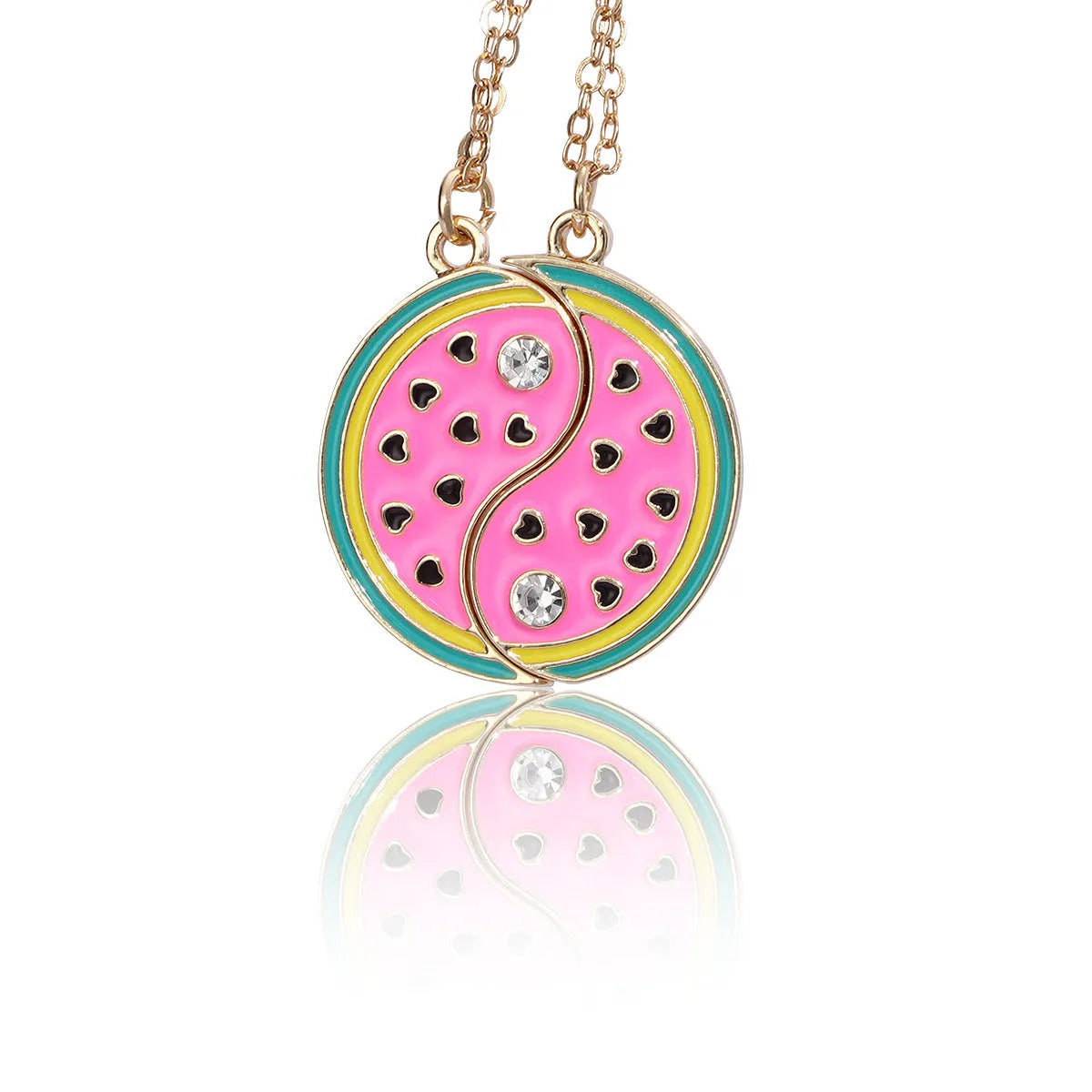 Two matching zinc alloy pendants in donut and watermelon shapes with glossy oil drip finish on cross chains