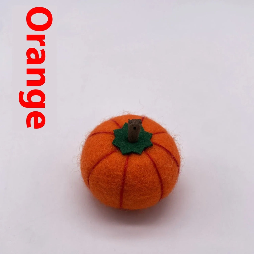 Wool felt pumpkin ornament decorations in autumn colours for seasonal displays
