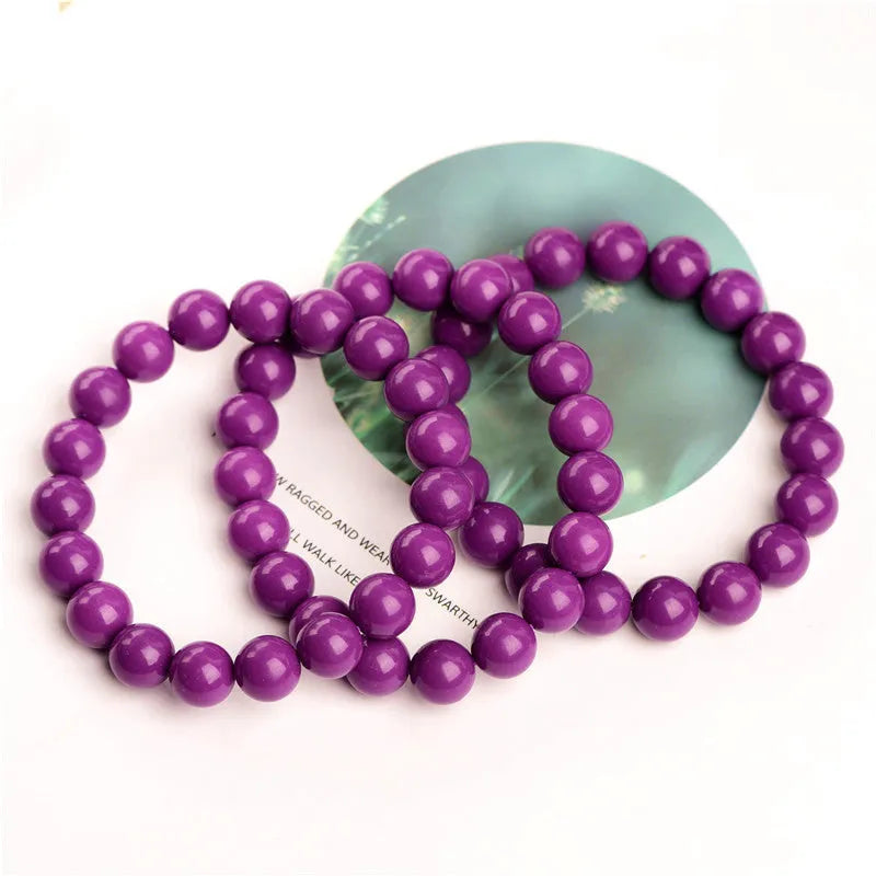 Polished purple mica crystal bracelet with original design on a wrist, showing 5A colour grade.