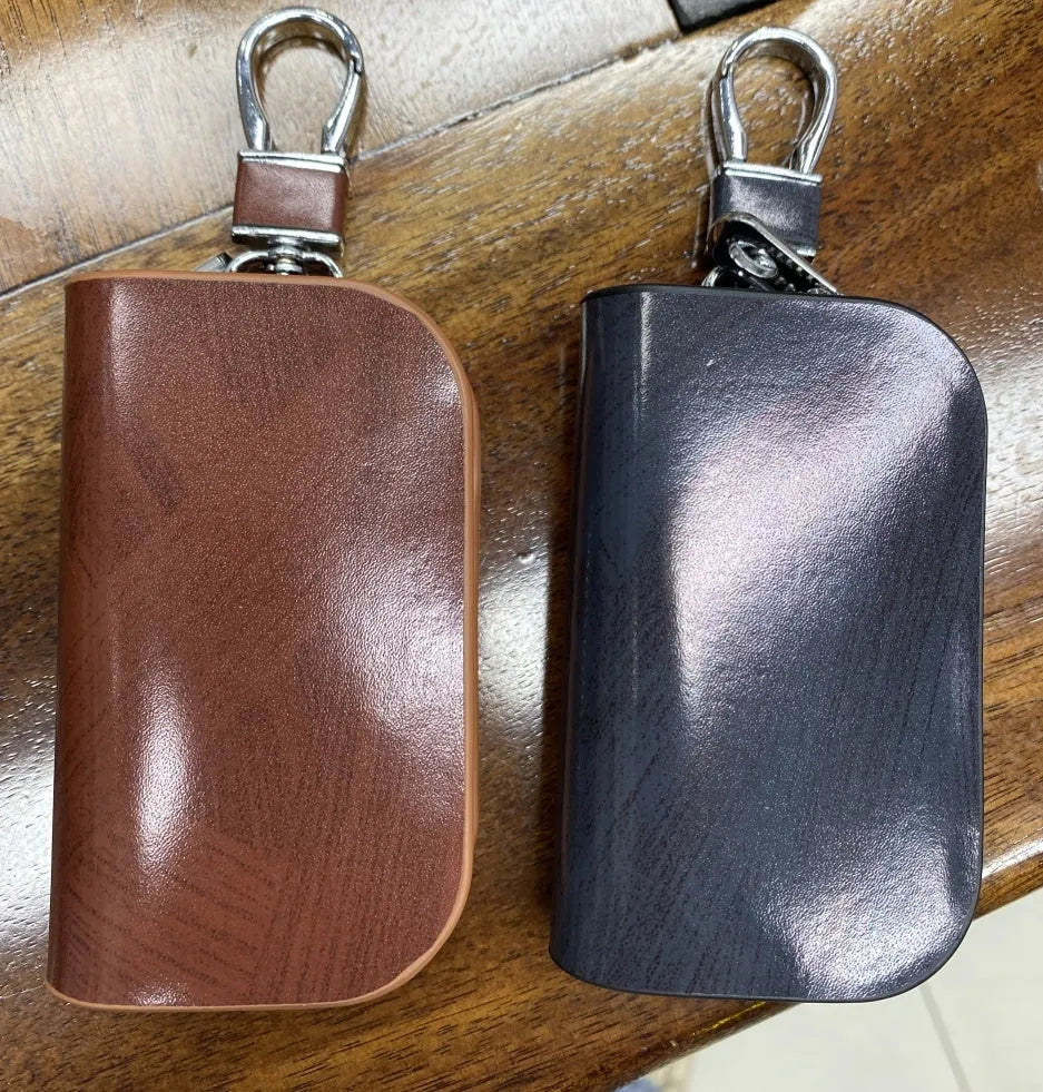 Genuine cowhide leather car key case with frosted finish in black and brown colours.