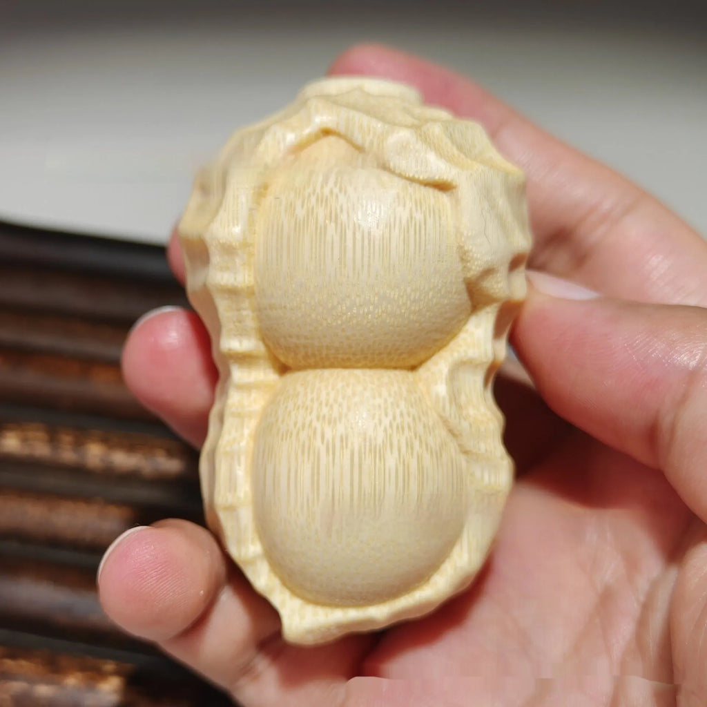 Natural solid bamboo peanut ornament with carving detail and modern simple style
