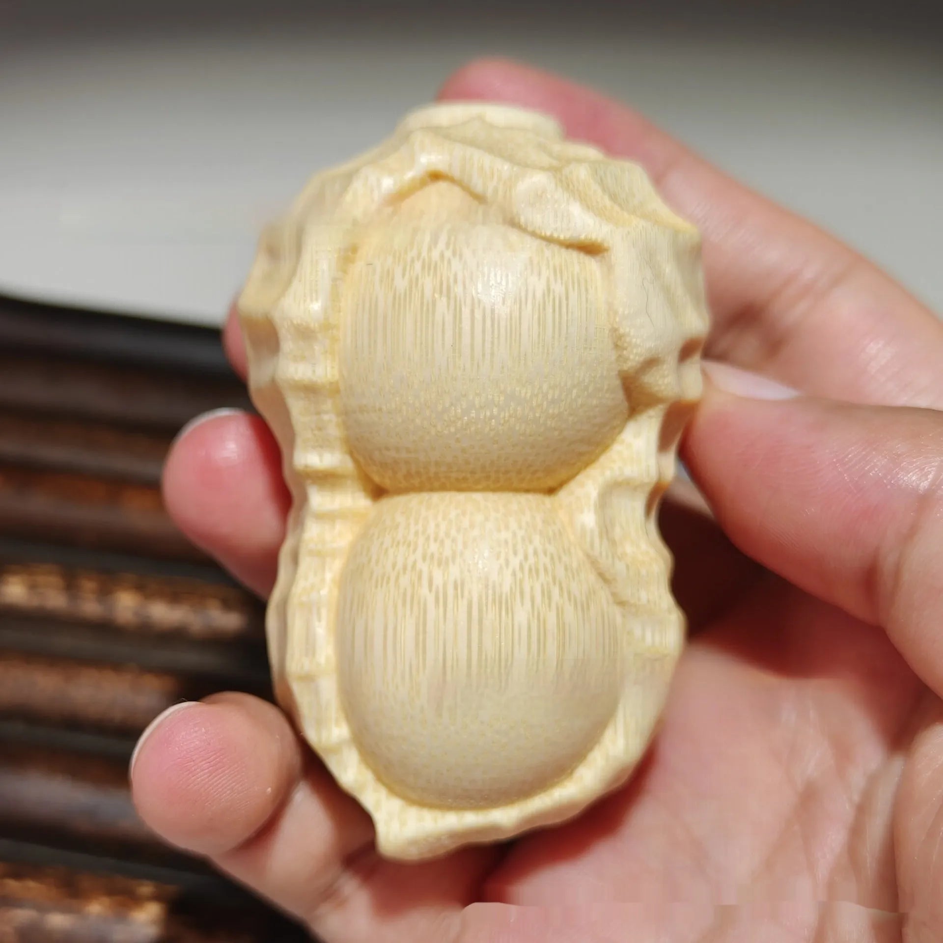 Natural solid bamboo peanut ornament with carving detail and modern simple style