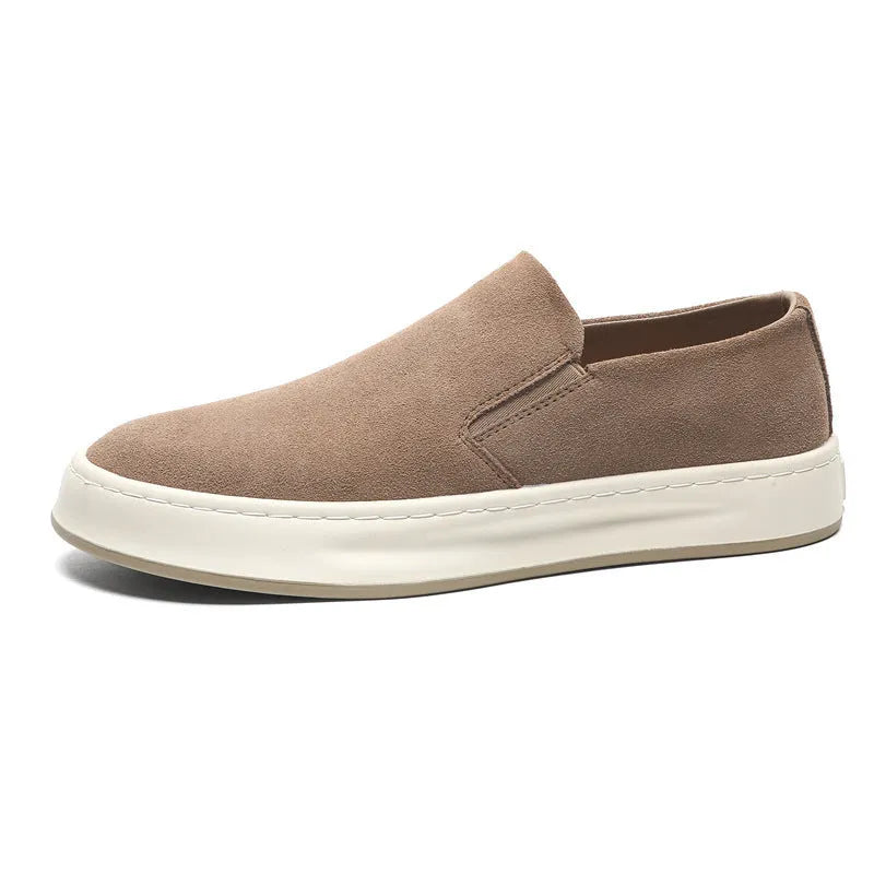 Men's grey slip-on casual shoes with round toe, mid-heel, and visible stitching on a rubber sole.