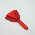 Red ABS plastic can opener and telescopic bottle opener tool on a kitchen counter.