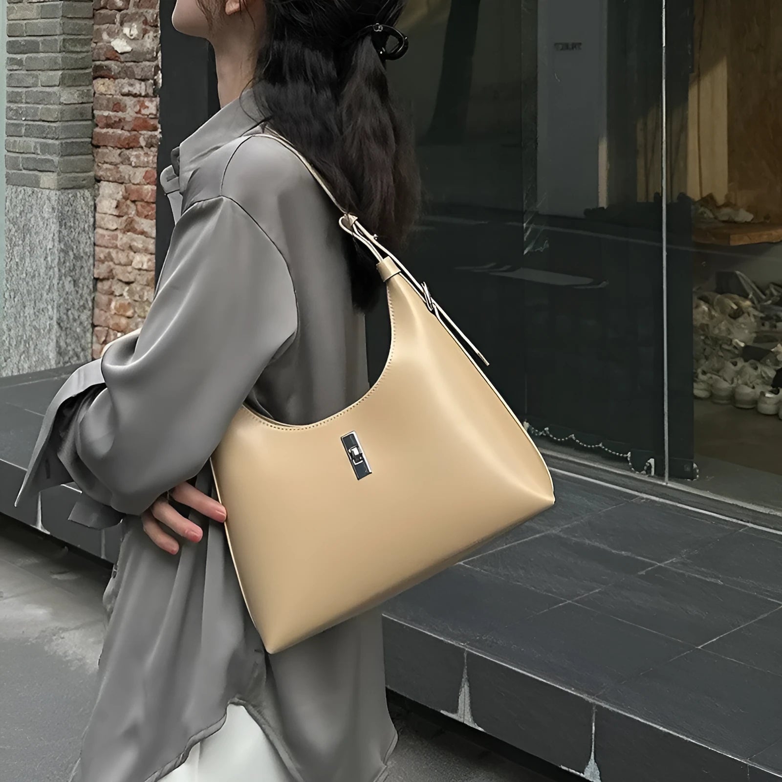 Genuine leather dumpling-shaped crossbody bag in apricot colour with shoulder strap