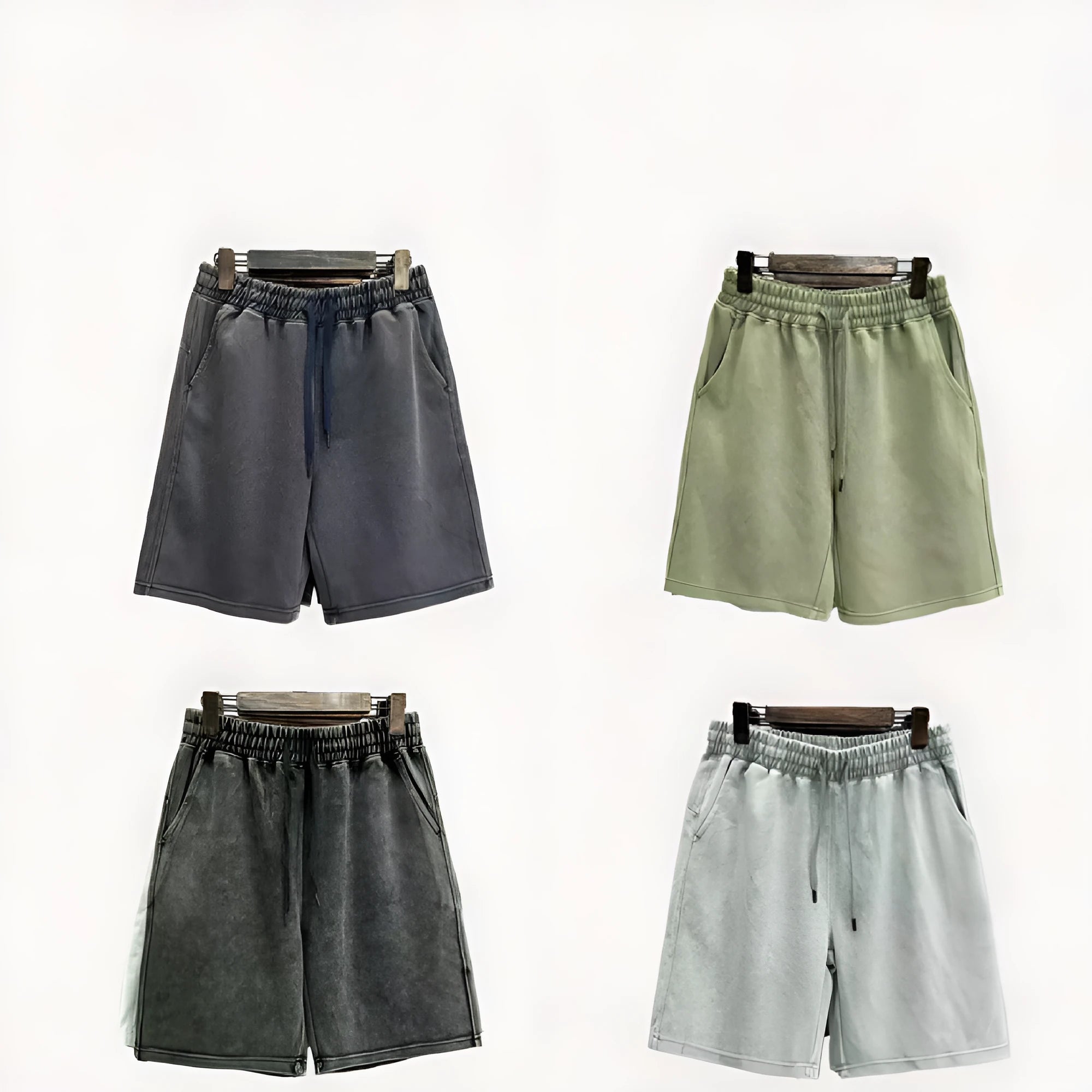 A pair of men's light blue distressed casual cotton shorts with a loose, straight-leg fit on a plain background.