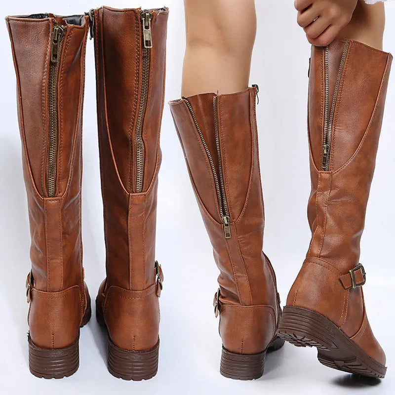 Women's black knight boots with a square heel, round toe, and decorative buckle.