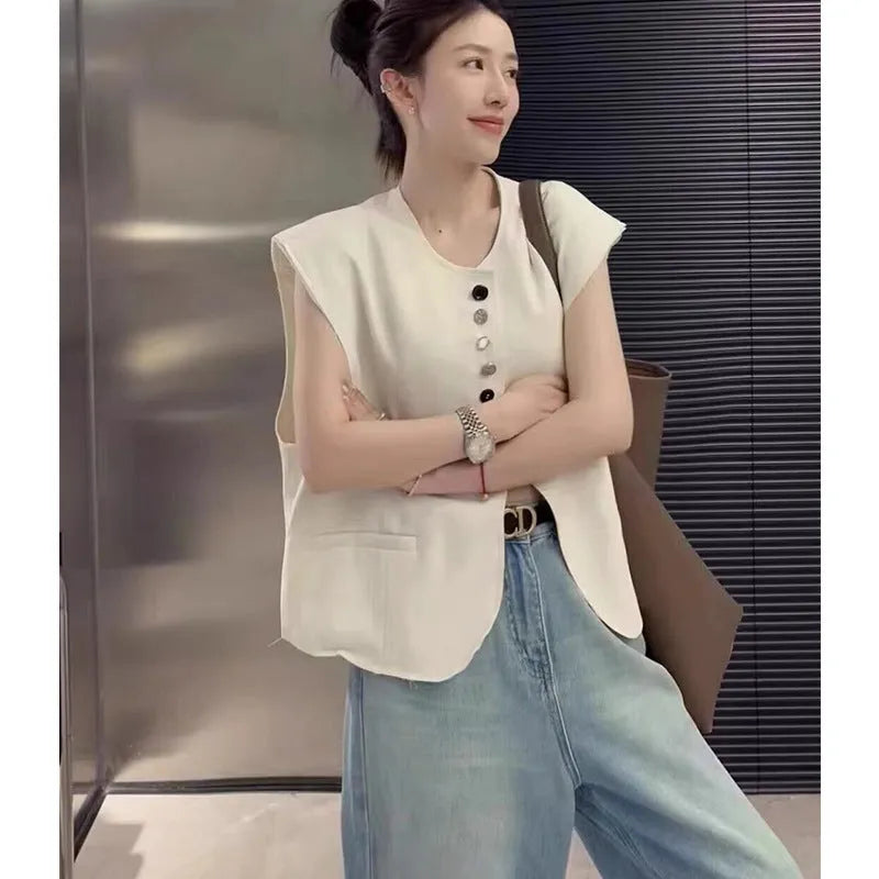 Women's polyester vest in milky white or black with pocket detail and loose fit