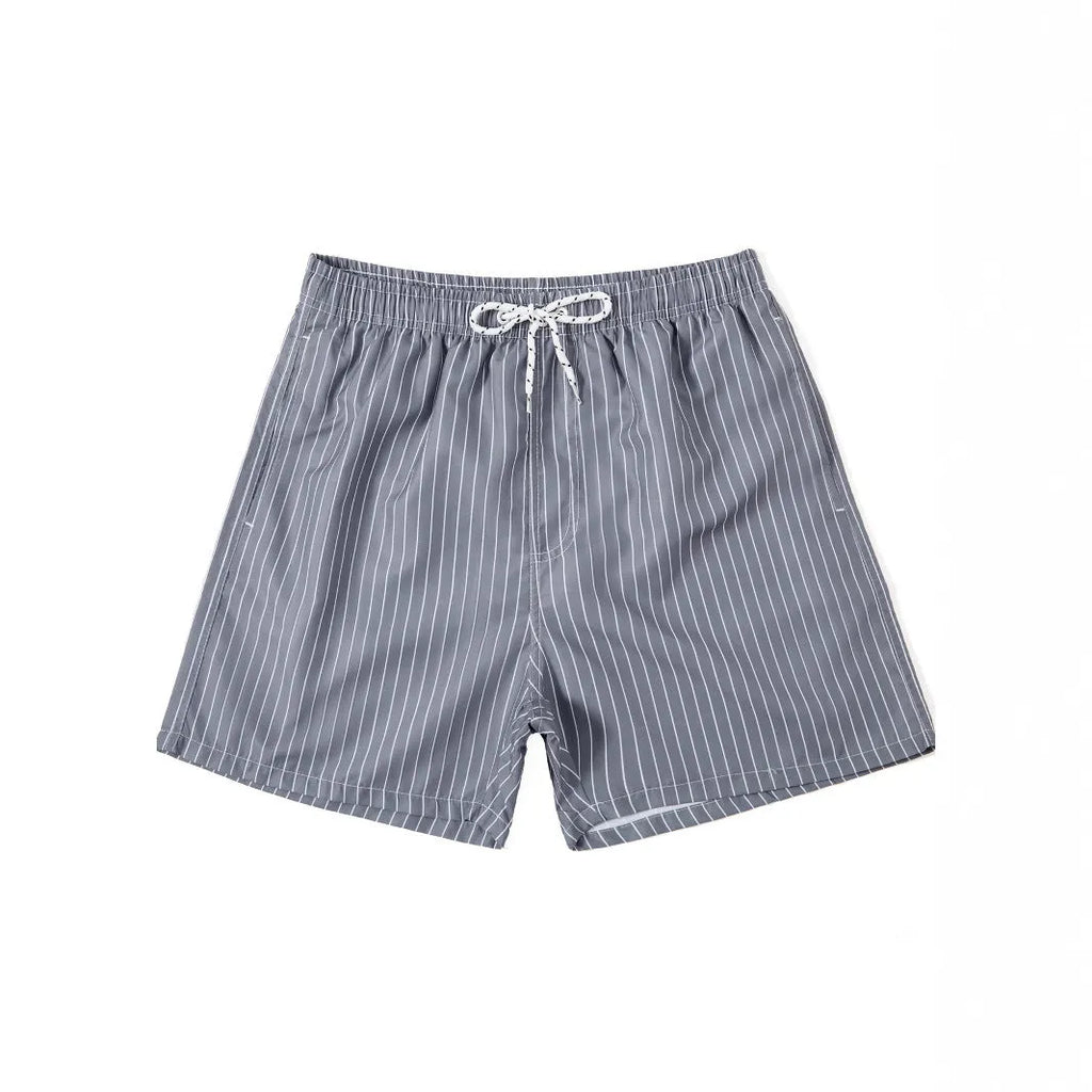 Polyester fibre striped beach shorts in navy blue with straight leg opening