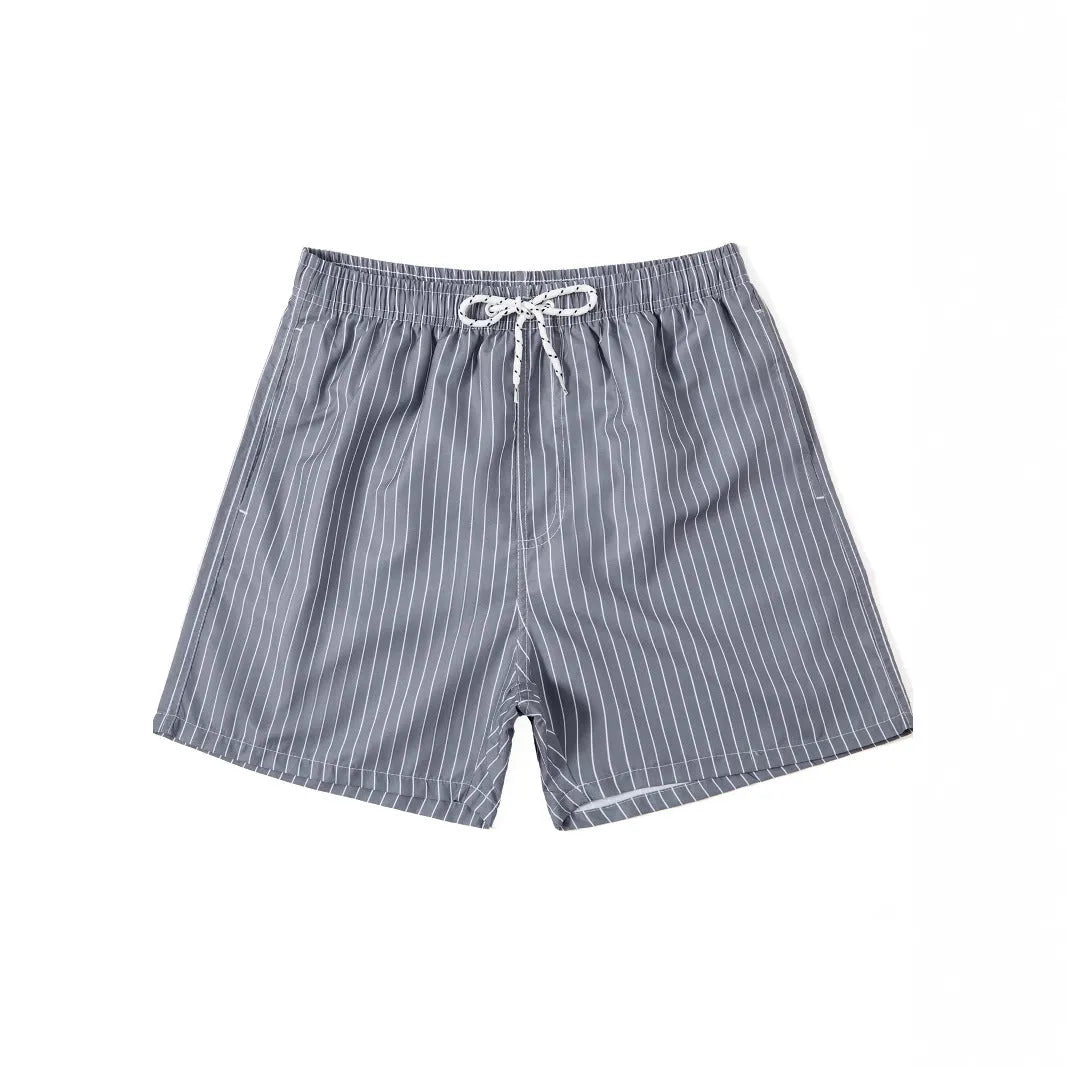 Polyester fibre striped beach shorts in navy blue with straight leg opening