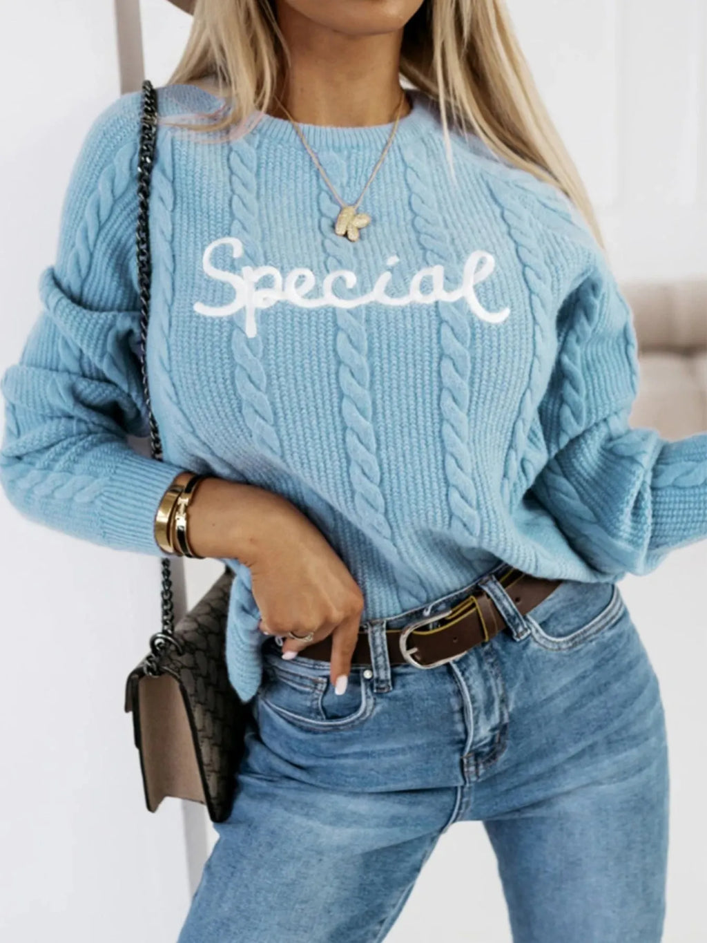 Blue leisure pullover with embroidered letters on the chest, crew neck design.