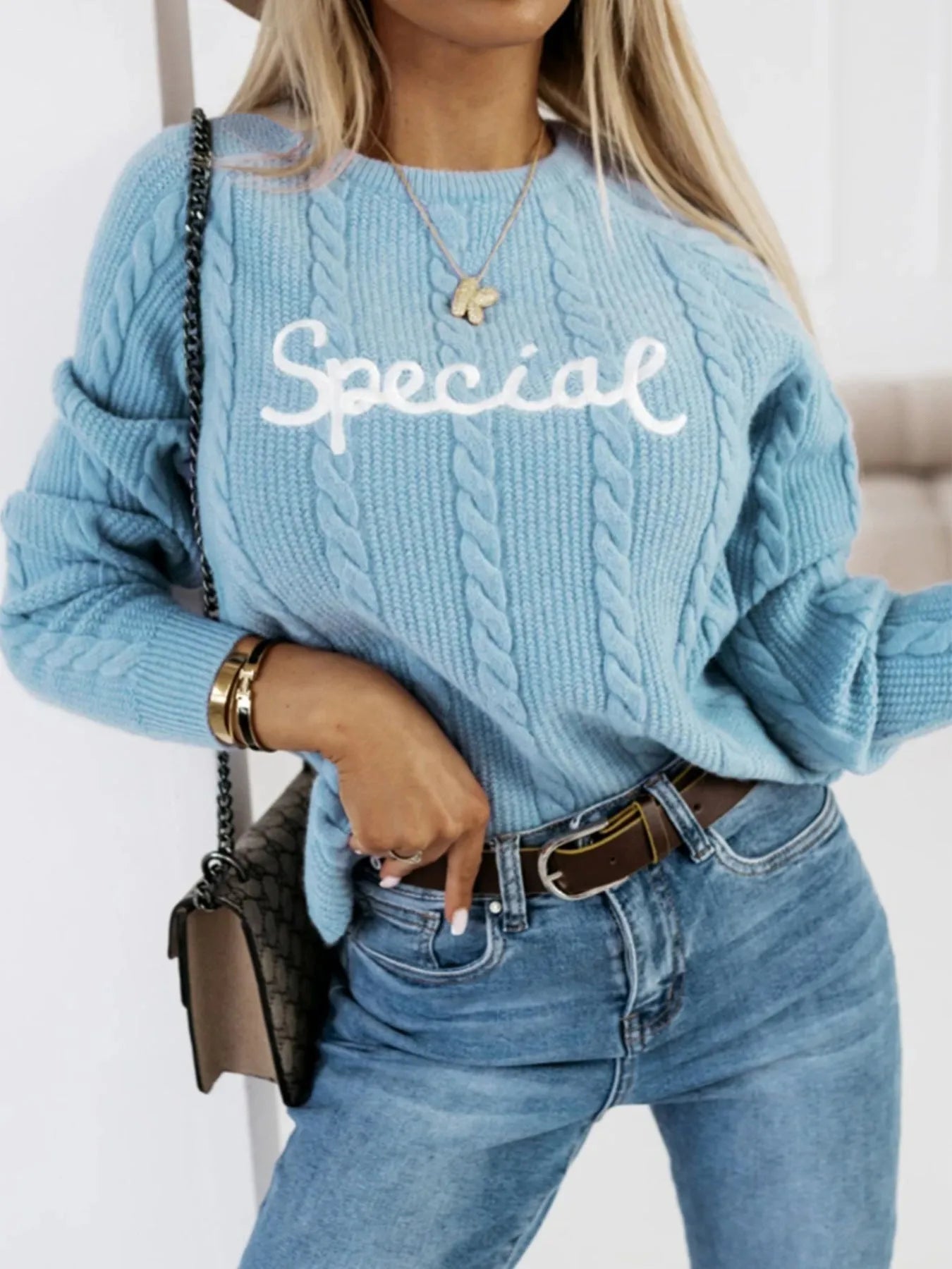 Blue leisure pullover with embroidered letters on the chest, crew neck design.