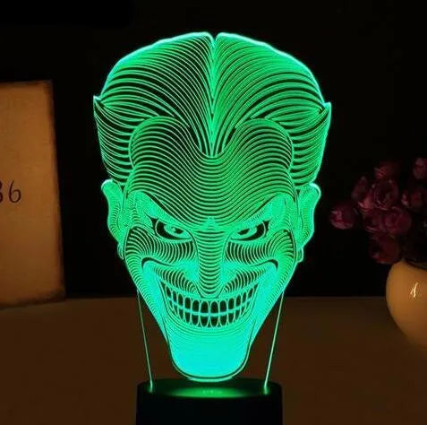 USB-powered 3D acrylic LED lamp showing colourful gradient illumination on a desk.