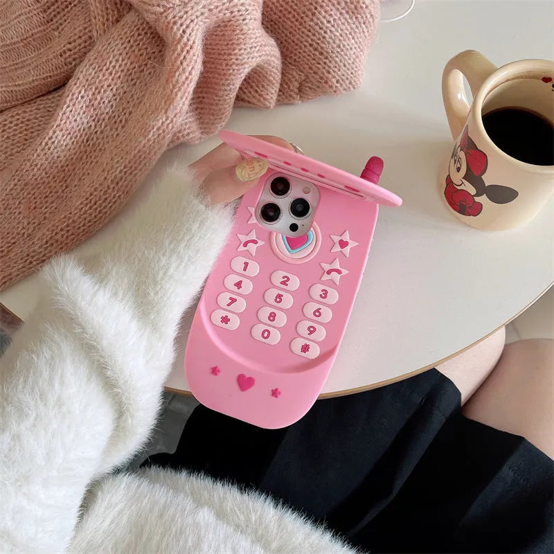 Light pink silicone flip phone shape mirror case for iPhone showing built-in mirror and nostalgic design