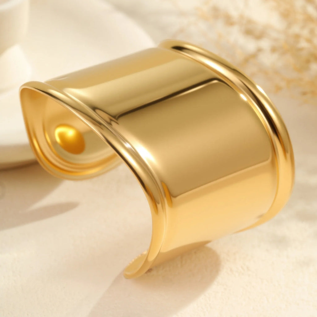 Women's gold plated stainless steel wide bracelet with wave geometric asymmetric design