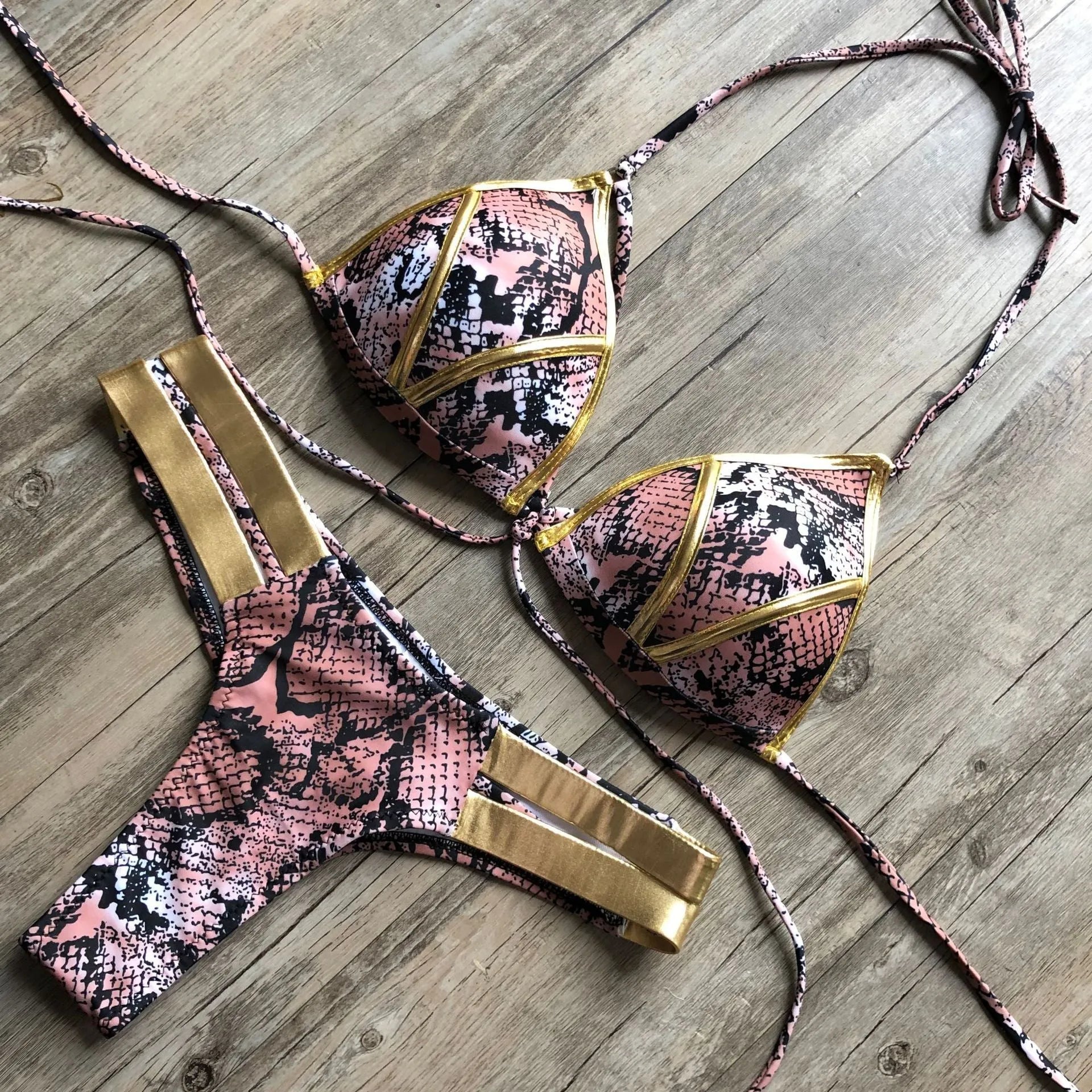 Women's bronzing bikini swimsuit with padded cups, shown in multiple colour and print options including leopard and snakeskin.
