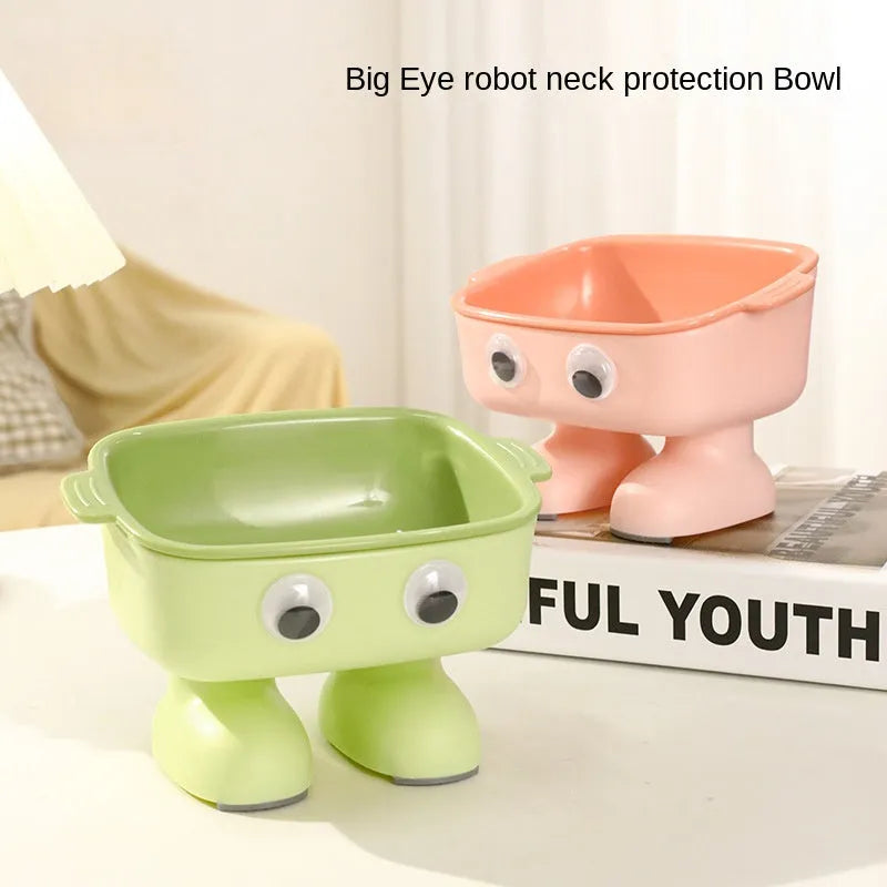 Green robot-shaped tilted cat bowl with detachable inner dish on a non-slip base.