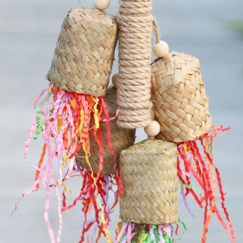 Colourful shredded paper parrot toy with wood and sisal construction measuring 35cm long